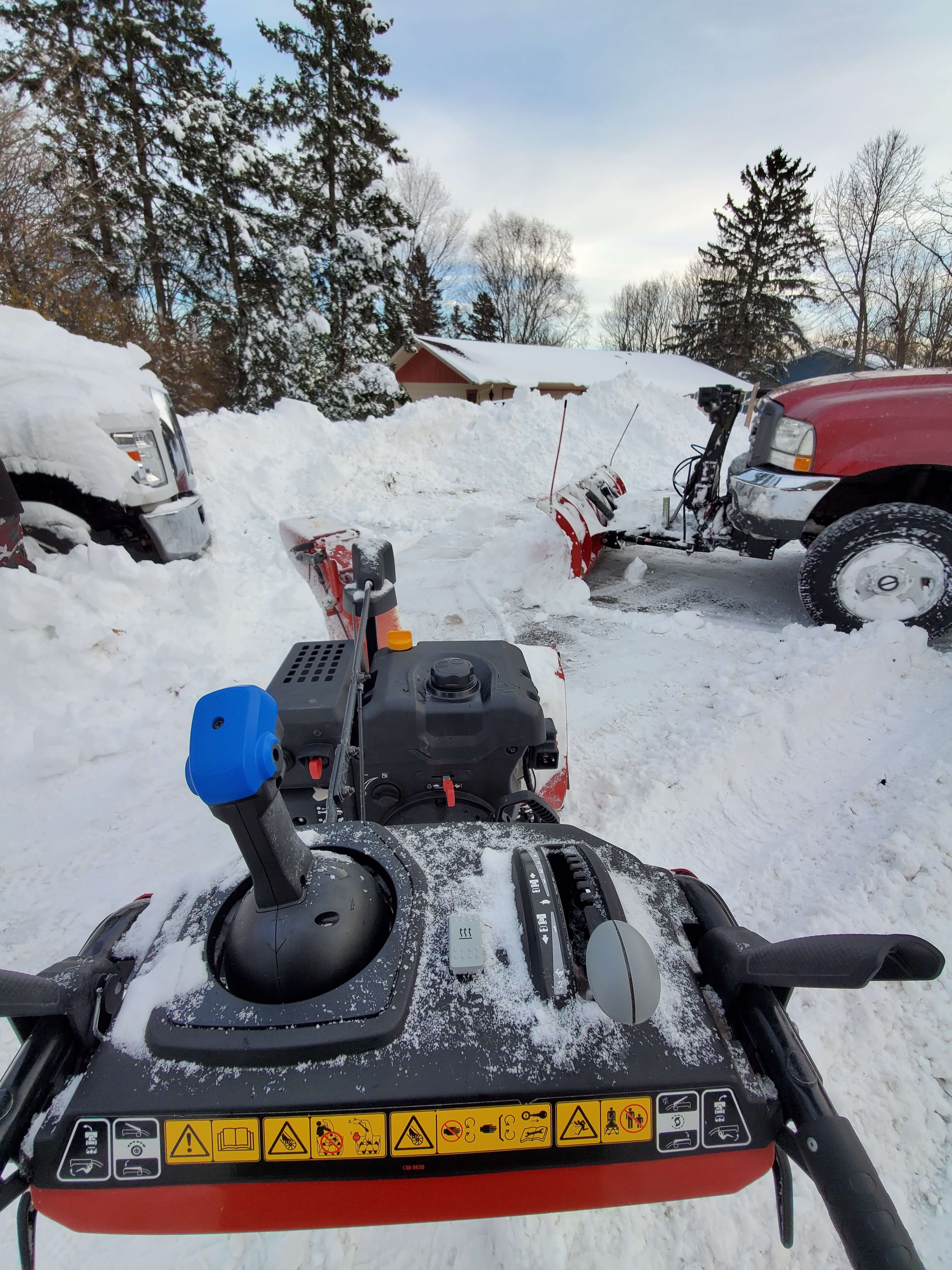 pciture of a snow plow pushing snow